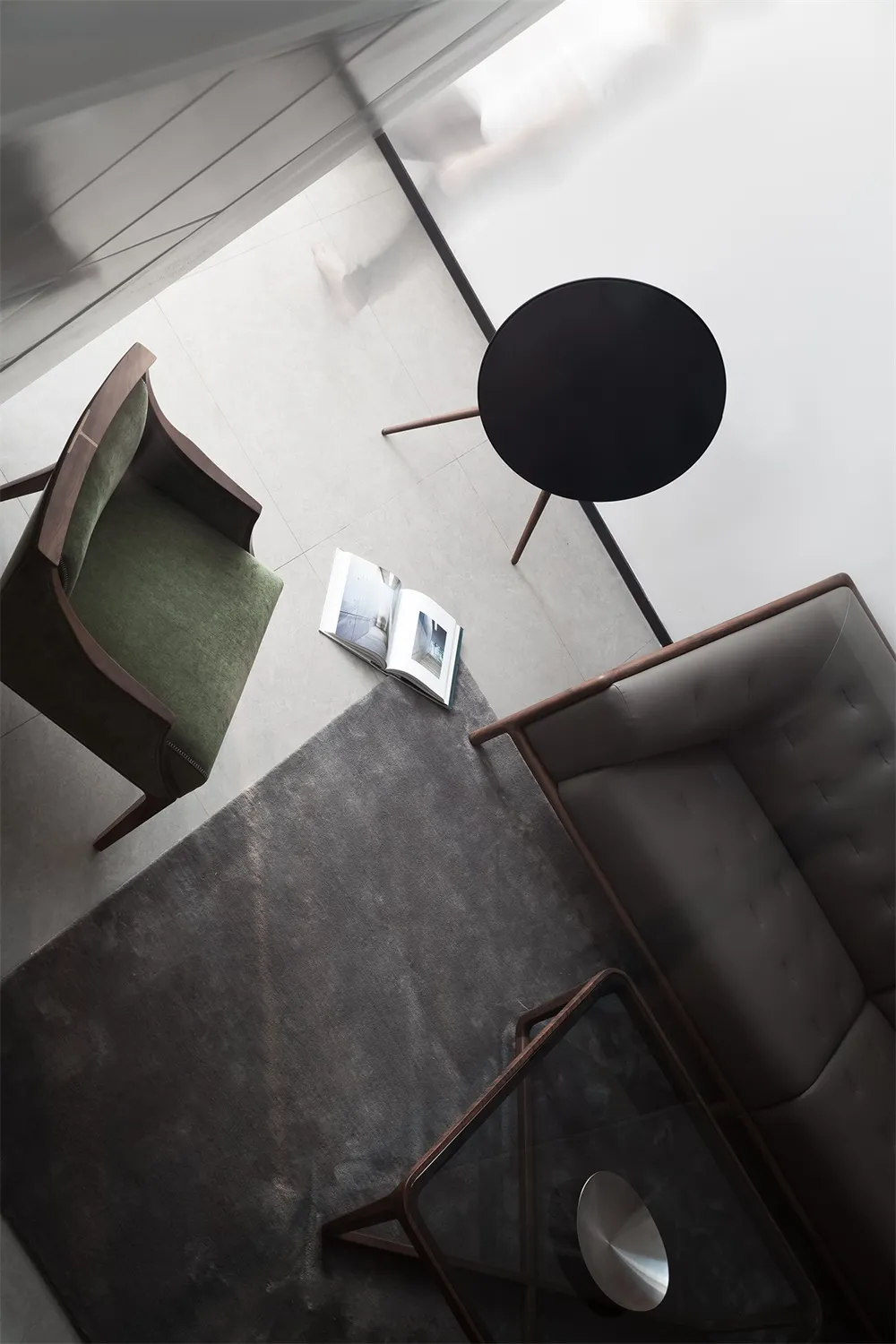 A modern living room featuring a mix of wood, leather, and cotton materials.