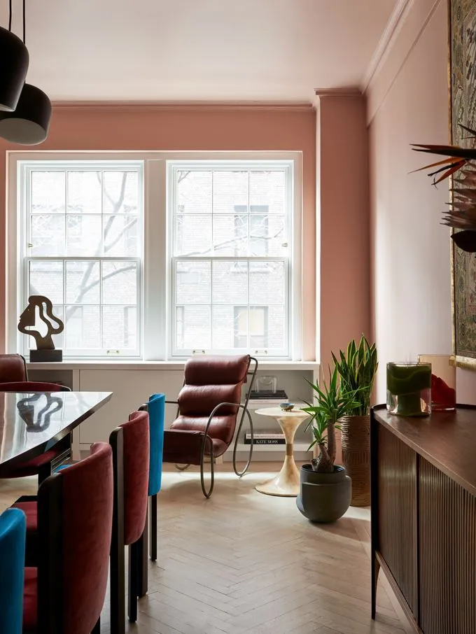 Modern dining room with wood, leather, glass, and metal elements