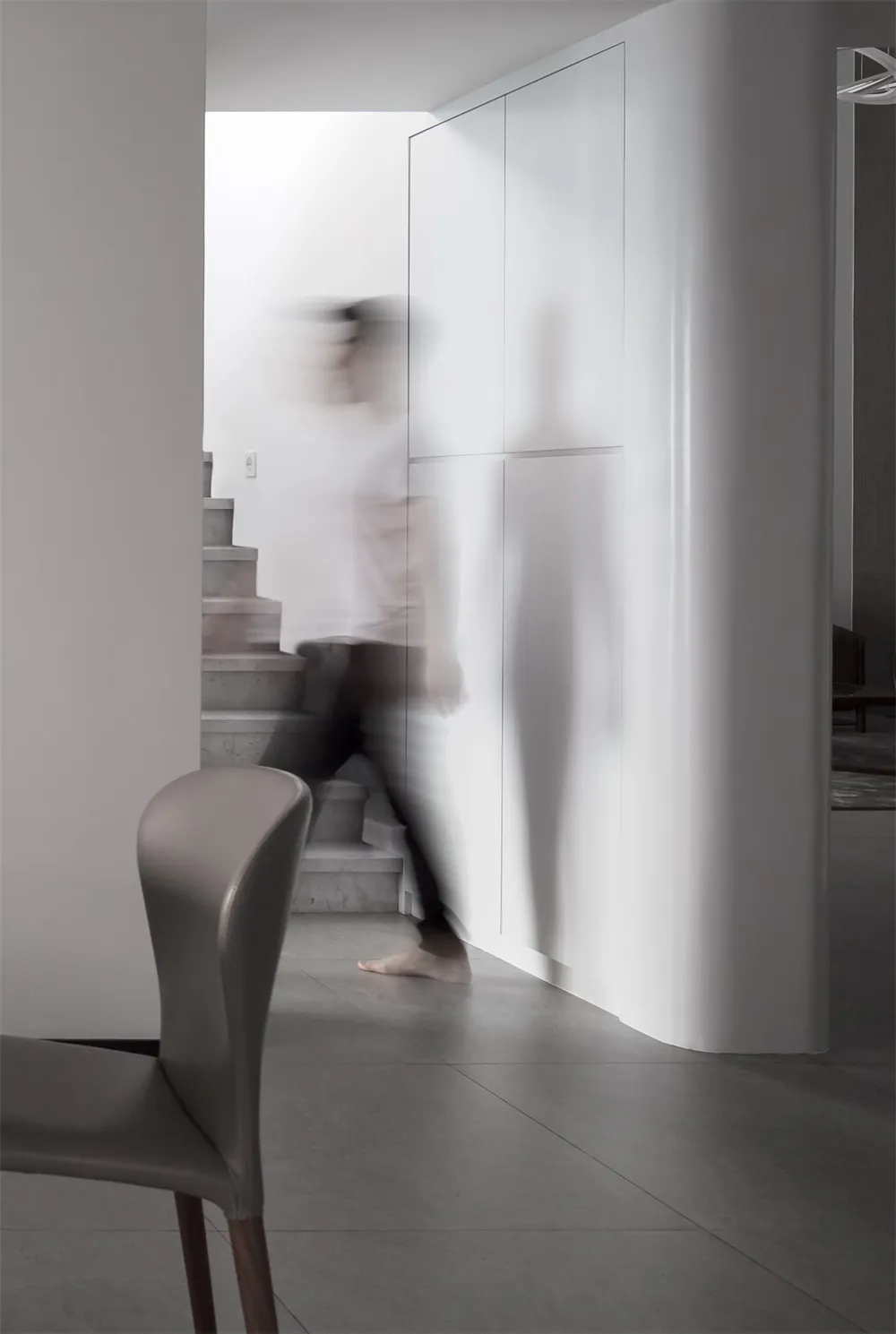 A minimalist interior design featuring concrete elements and clean, simplistic lines.