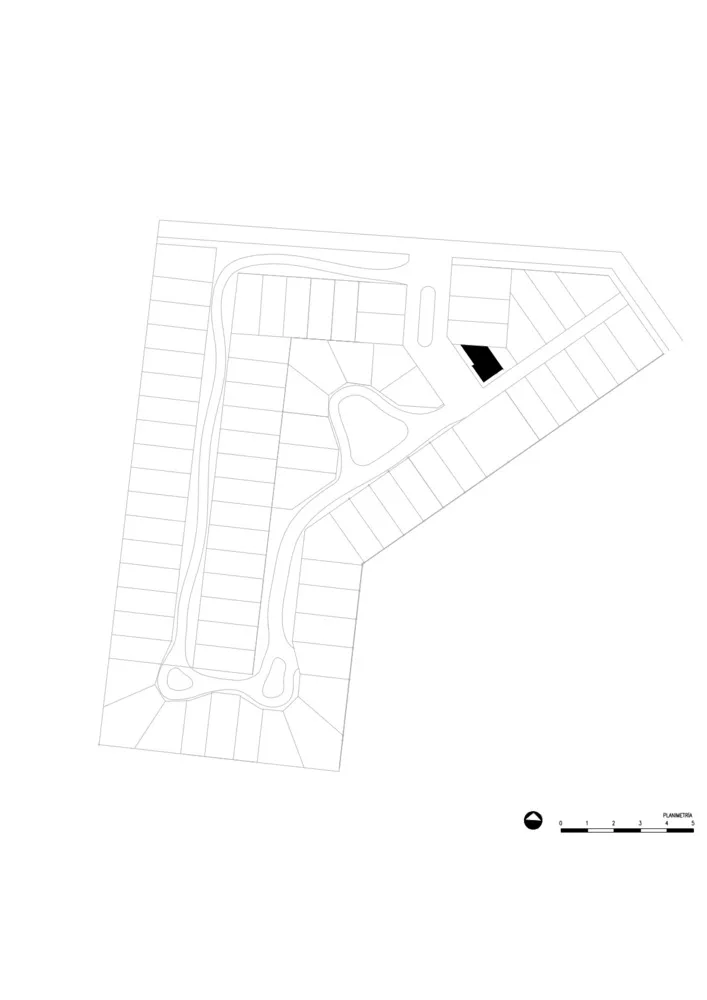 A black and white architectural site plan with scale and directional compass.