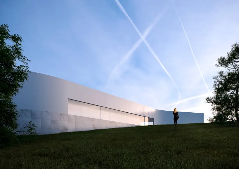 A modern white concrete exterior building with a minimalist design.