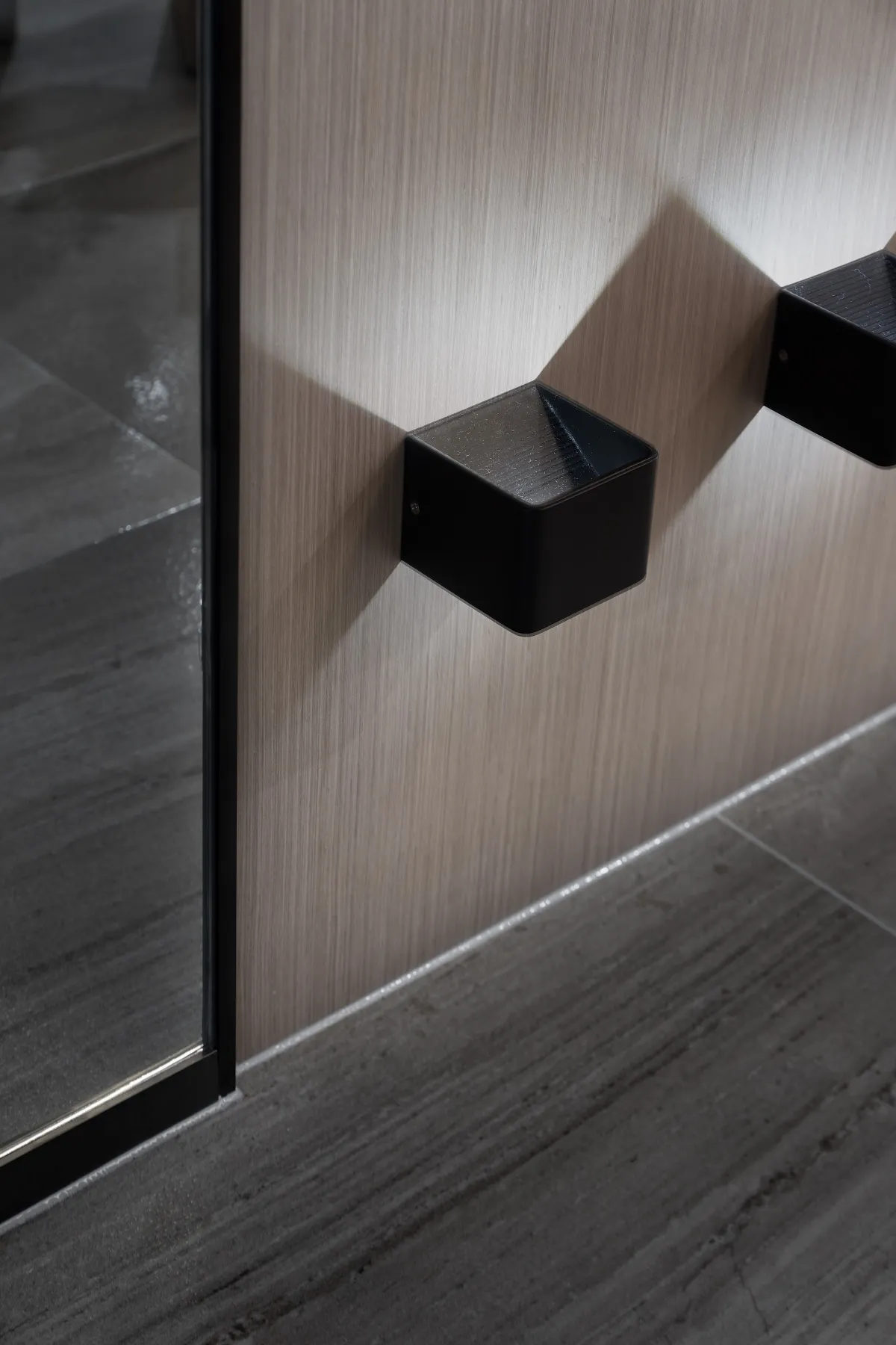 Modern minimalist interior lighting fixture with a black metal finish.
