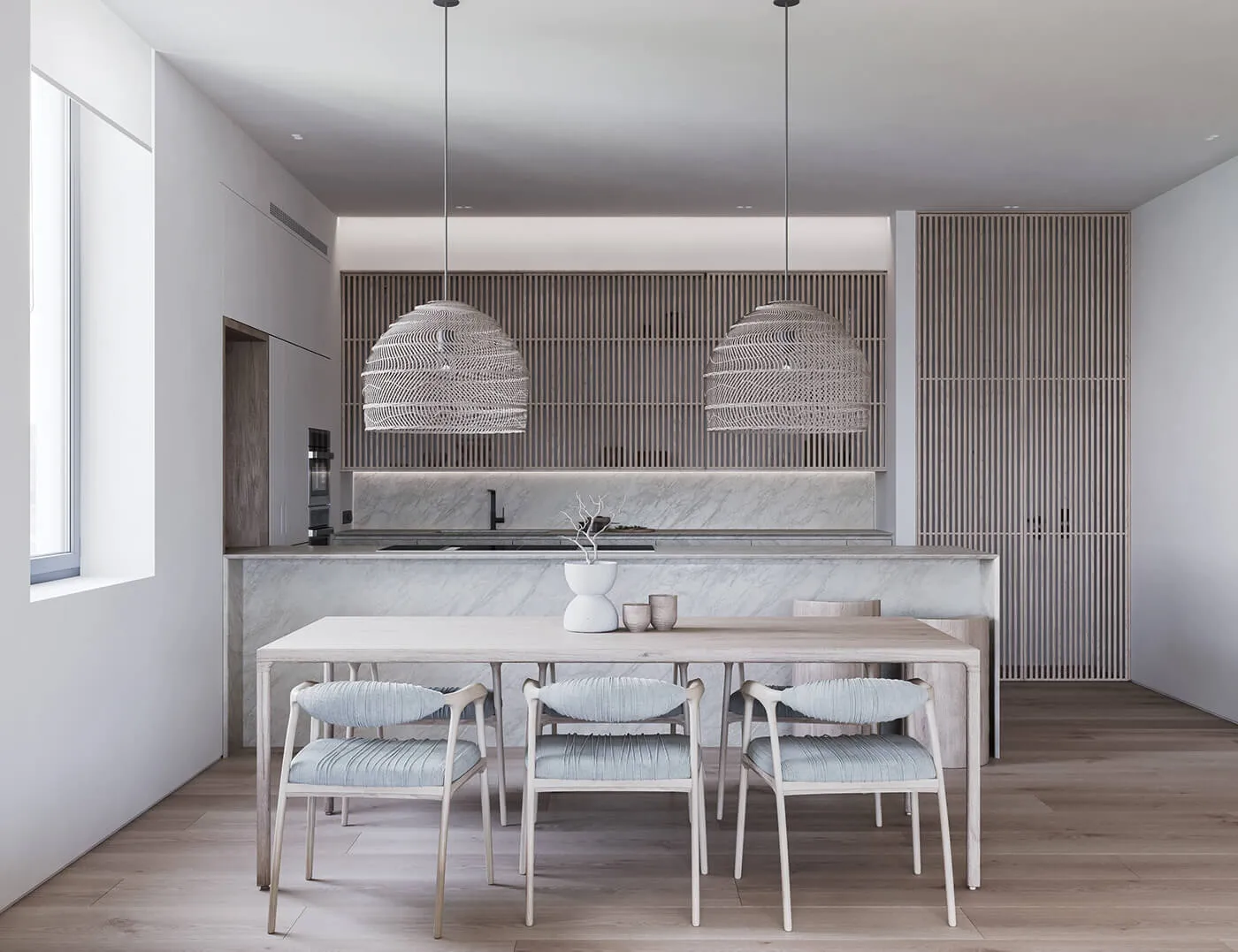 Minimalist kitchen and dining space with marble accents and wooden furniture.