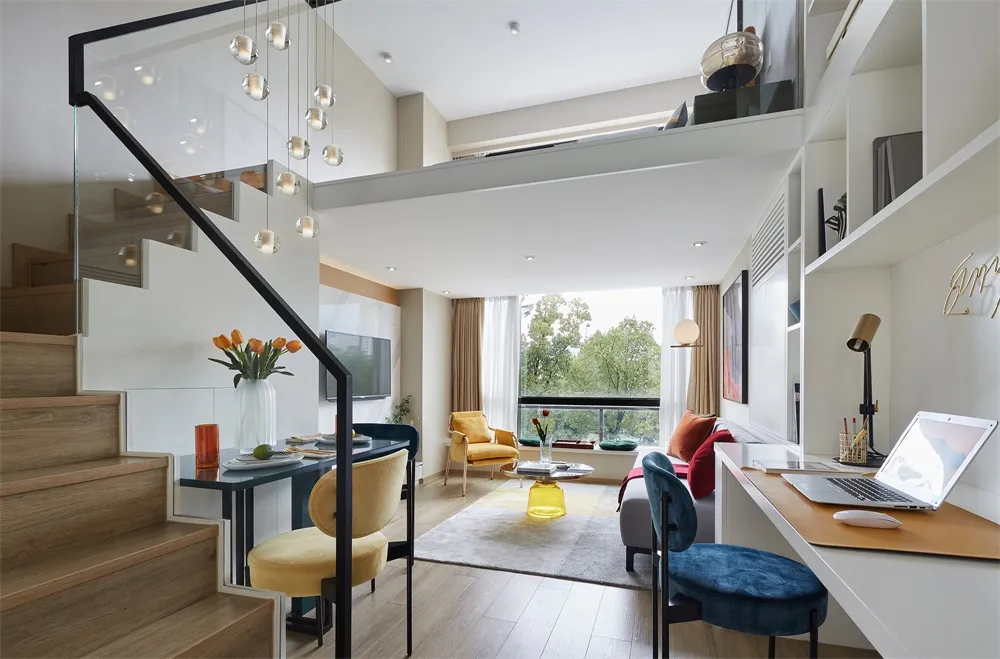 A modern living room with concrete flooring and furniture.