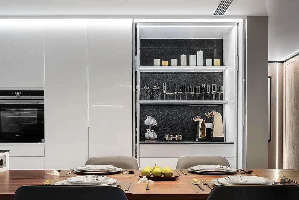 Modern kitchen with polished concrete countertops, marble backsplash and stainless steel appliances