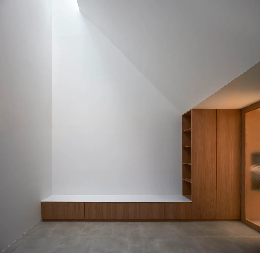 Minimalist interior with wood and white elements.