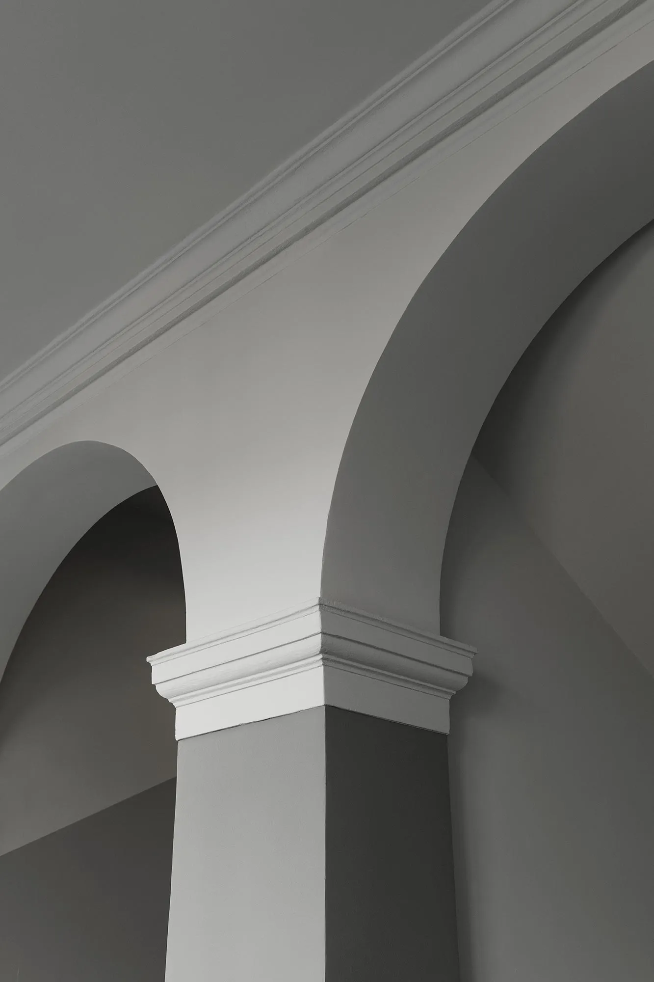 An image showing a classical architectural column made of concrete.