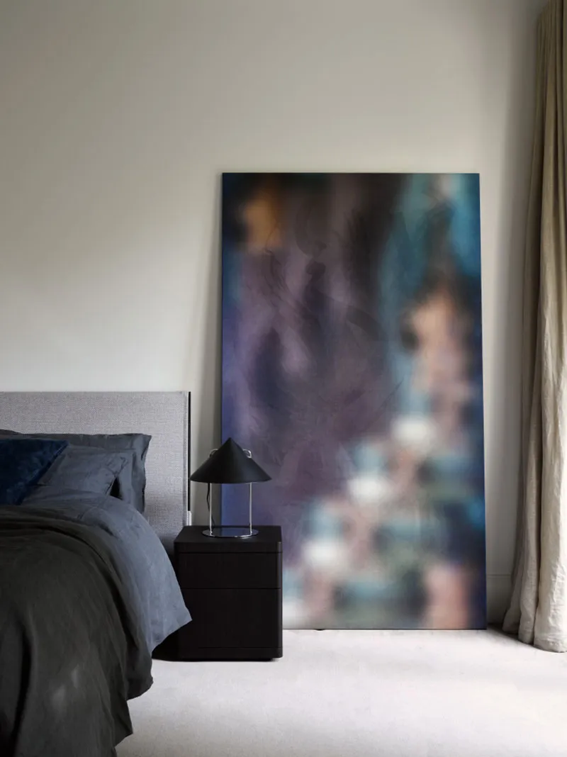 Modern bedroom featuring abstract fabric texture art, minimalist design, and contemporary interior elements.