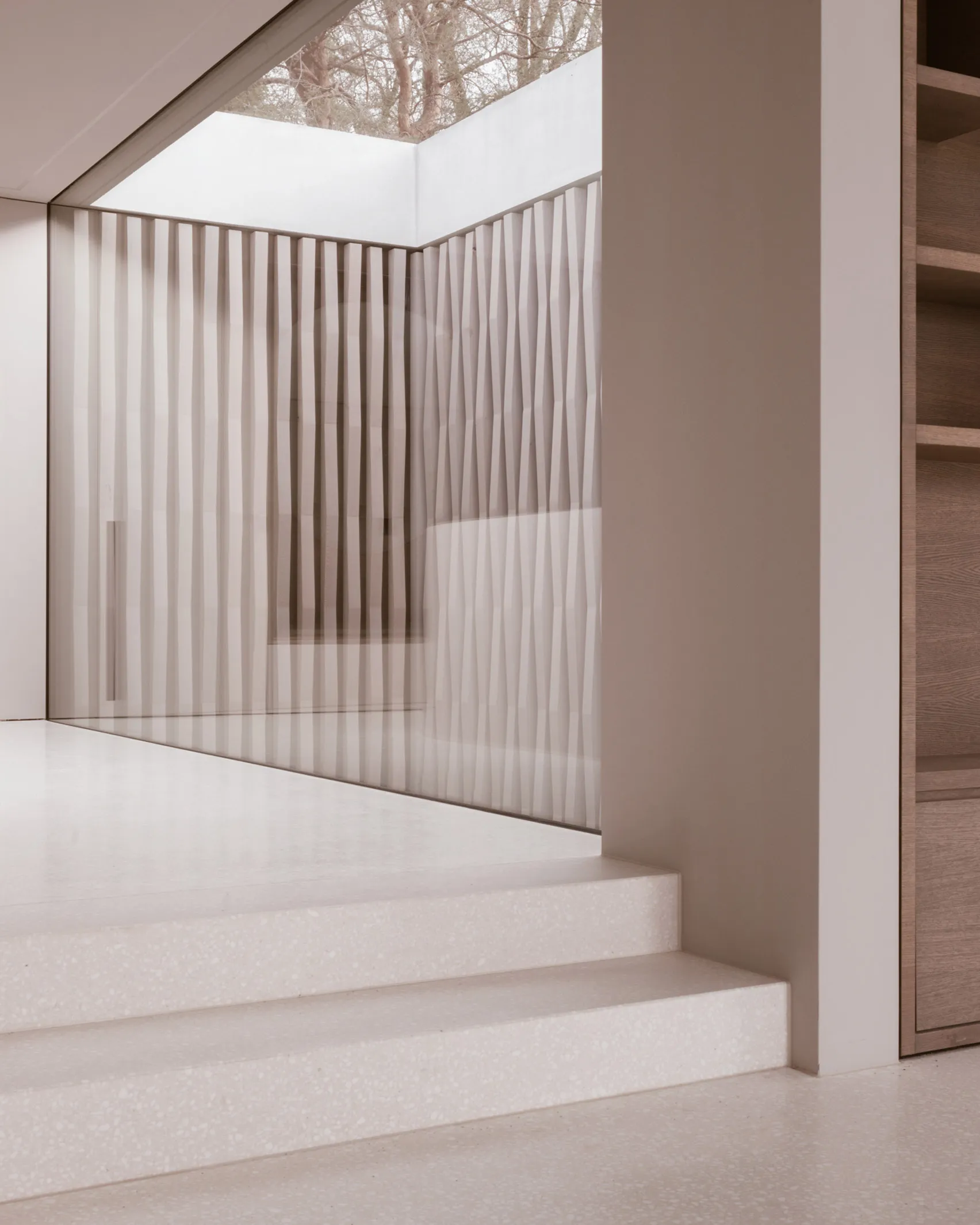 Modern interior design featuring glass pathways and vertical glass panels.