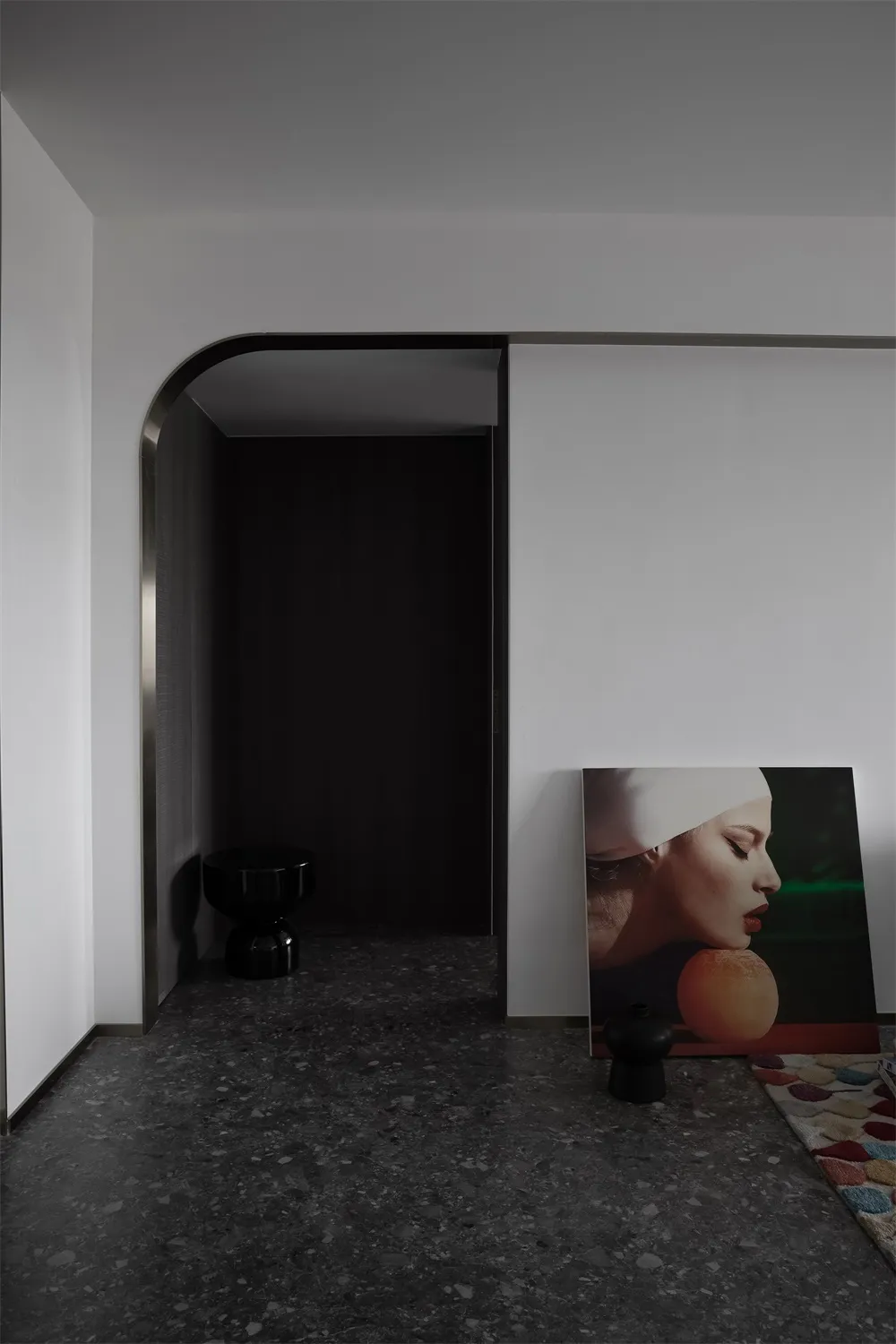Minimalist living space featuring concrete flooring and walls.