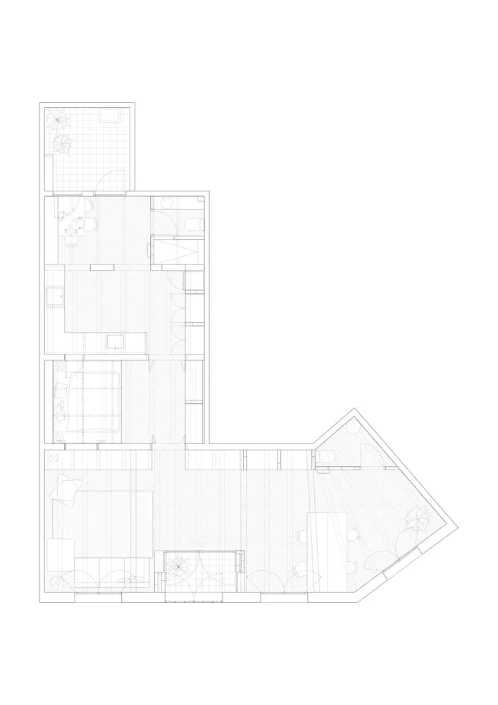 A black and white architectural drawing of an L-shaped floor plan with concrete features.
