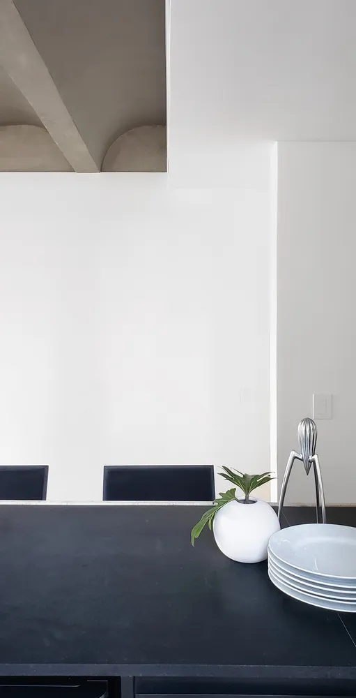 Modern kitchen featuring a sleek white granite countertop with sleek design elements and clean lines.