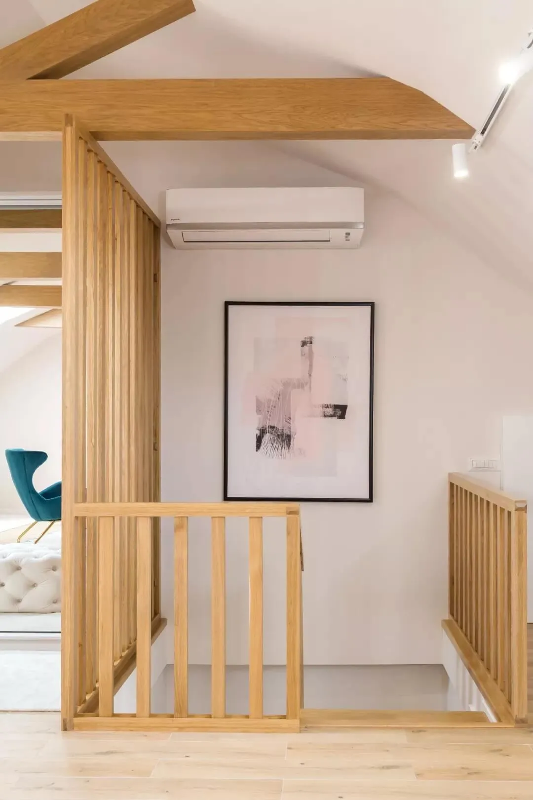 A minimalist interior design featuring a wooden staircase.