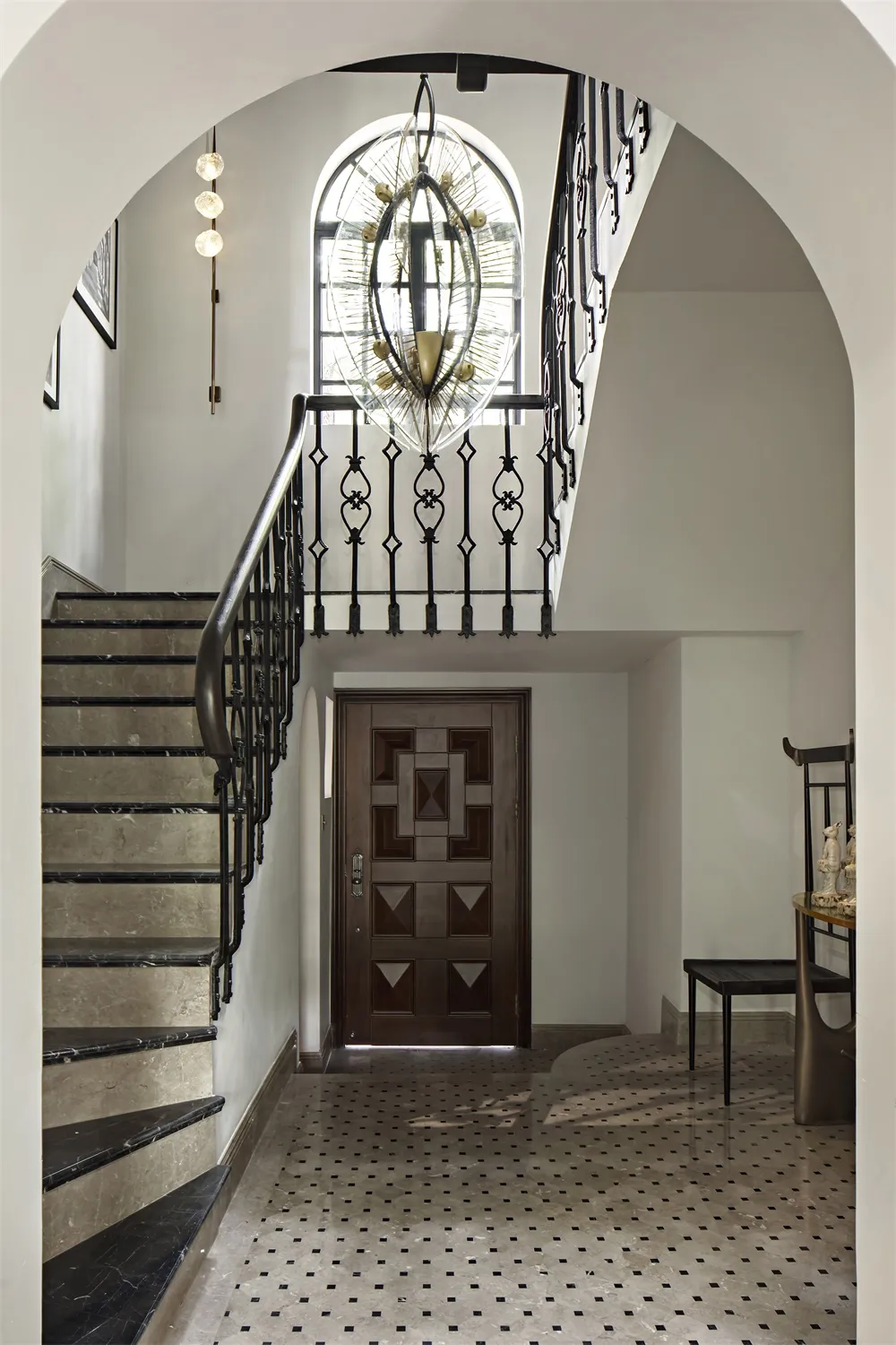 Entrance hall with marble stairs and flooring.