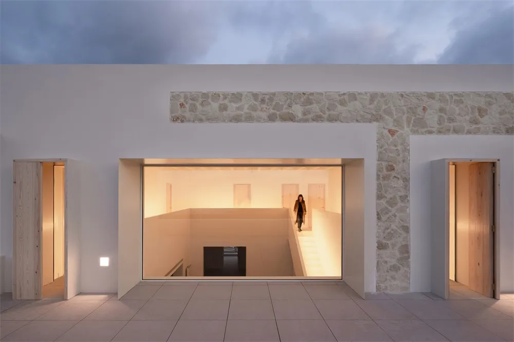 A modern architectural interior with stone and glass materials