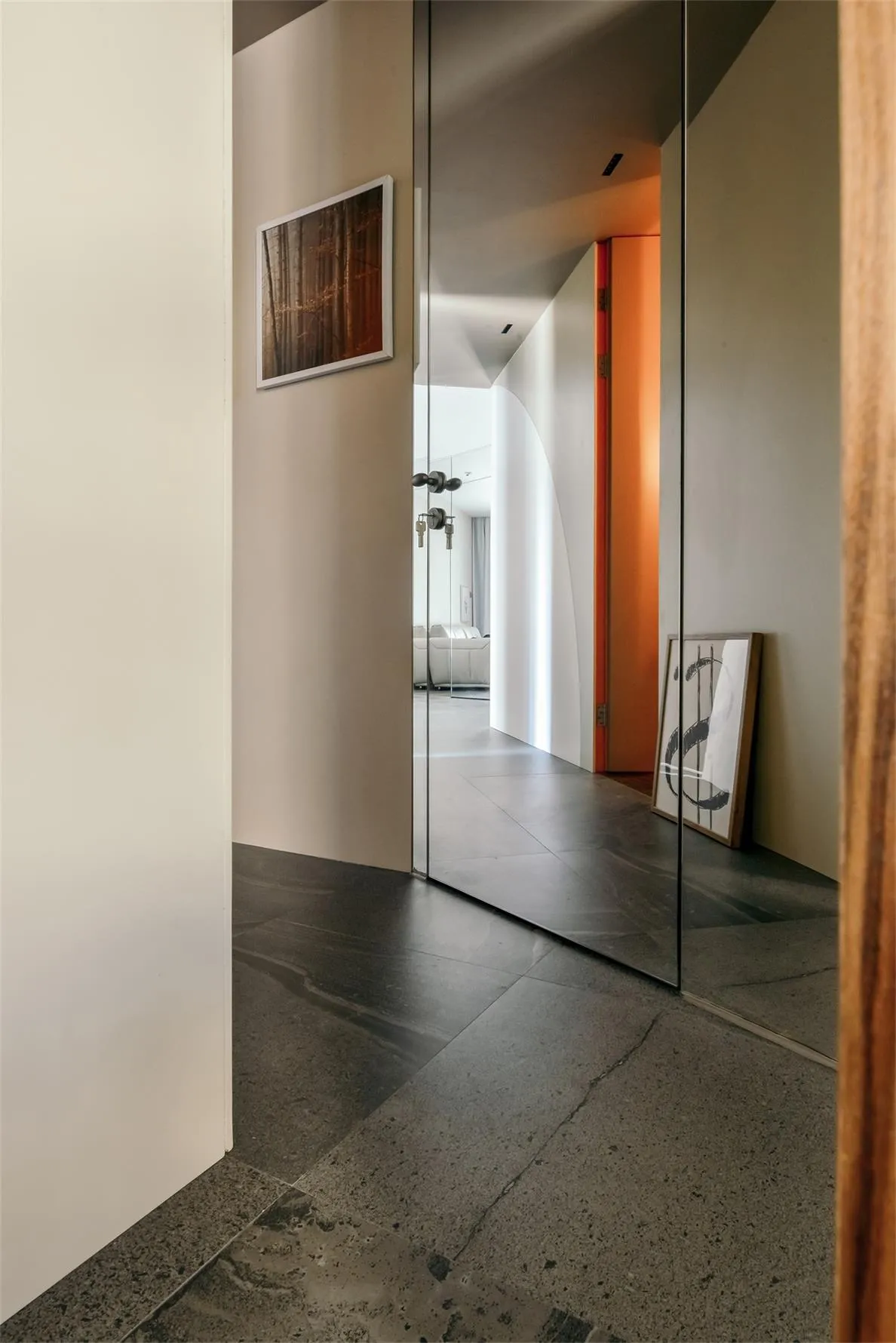 Modern interior design featuring metallic floor tiles and sleek lines.