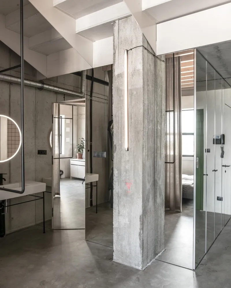 Modern industrial office space featuring concrete and glass materials