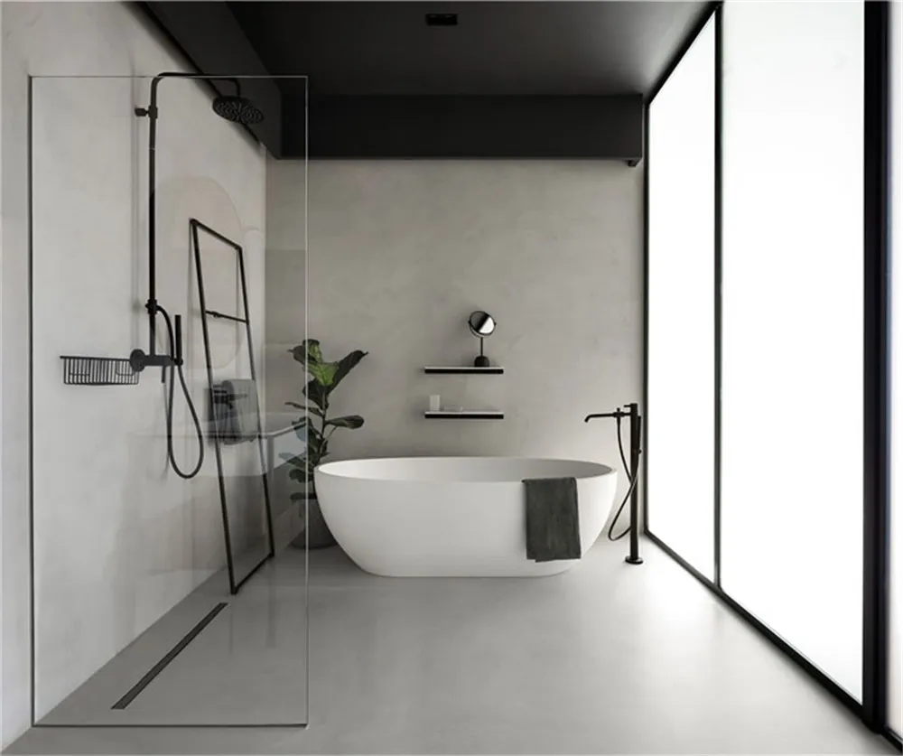 A modern minimalist bathroom featuring a freestanding bathtub, concrete walls, and a glass shower enclosure.