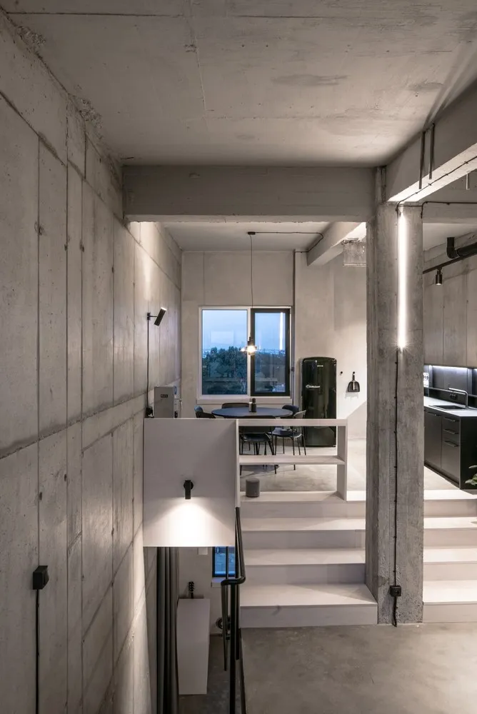 Concrete staircase with modern lighting fixtures