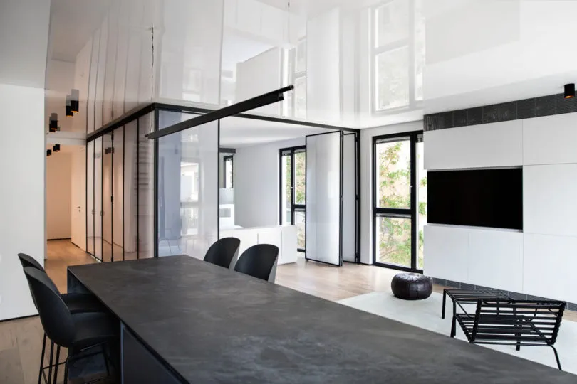 Modern living room featuring a concrete table and minimalist design elements.