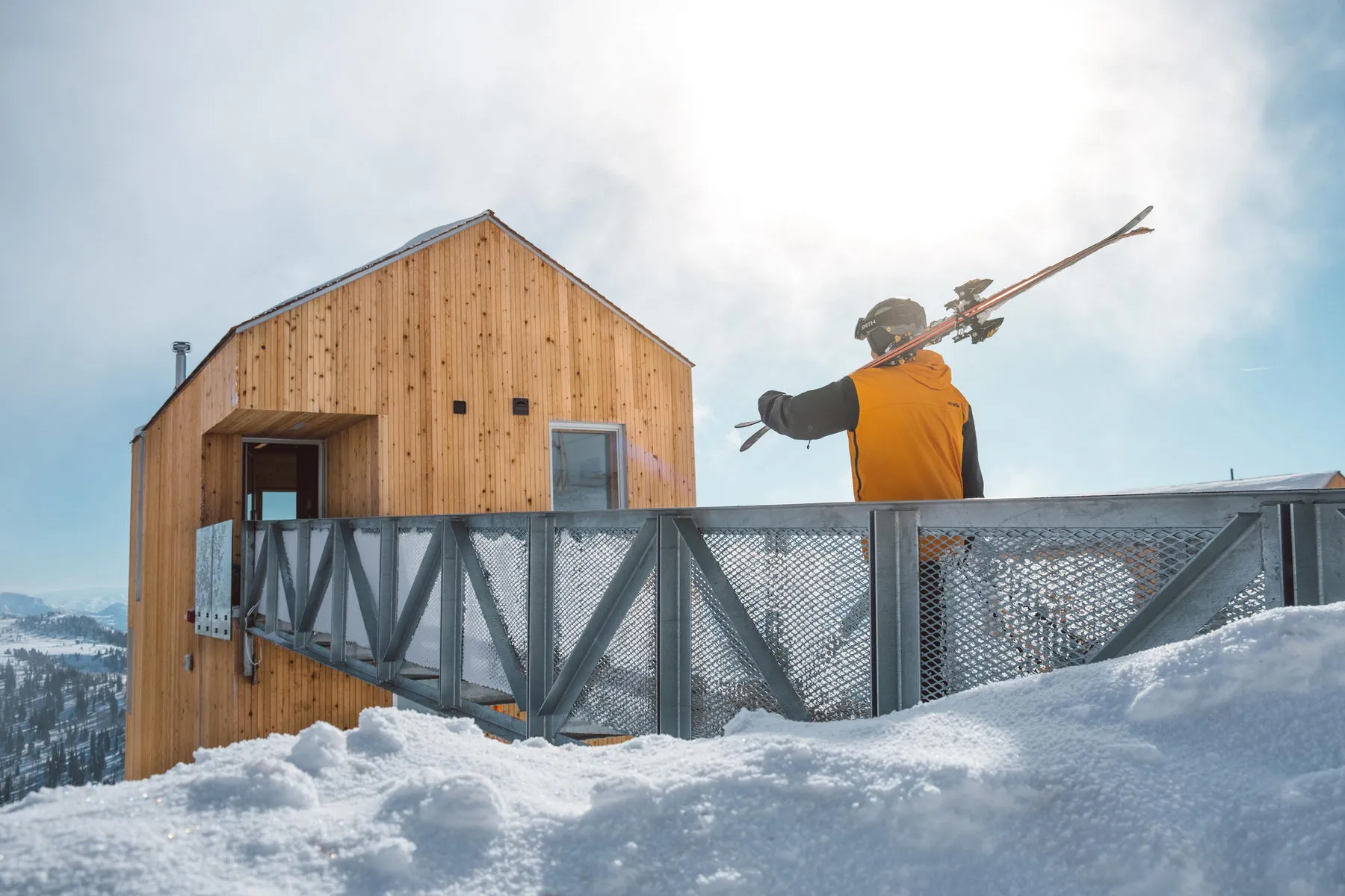 A ski lift station with a metal and wooden structure.