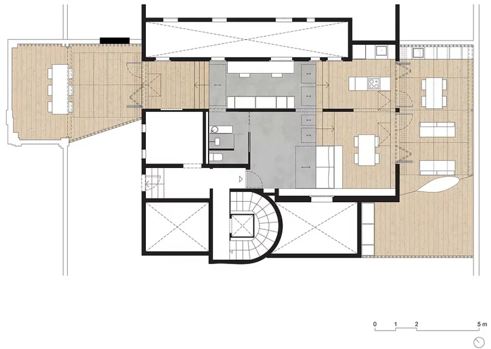 A modern residential floor plan featuring wooden flooring and a central staircase.