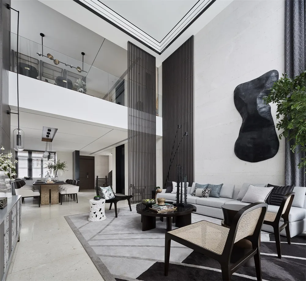 A modern living room with geometric black accents, concrete walls, and minimalistic furniture.
