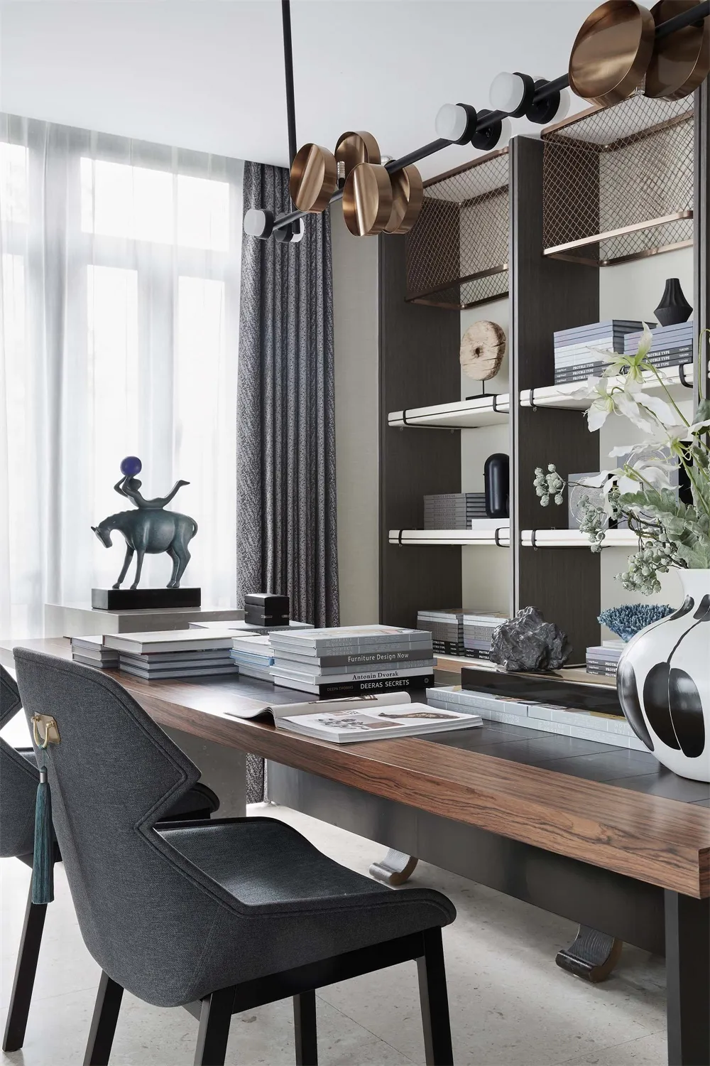 A modern office space featuring wooden desk, metal chairs, and glass shelves.