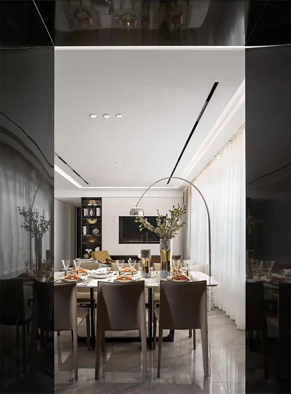 Modern dining room with marble table and chairs, featuring contemporary design elements.