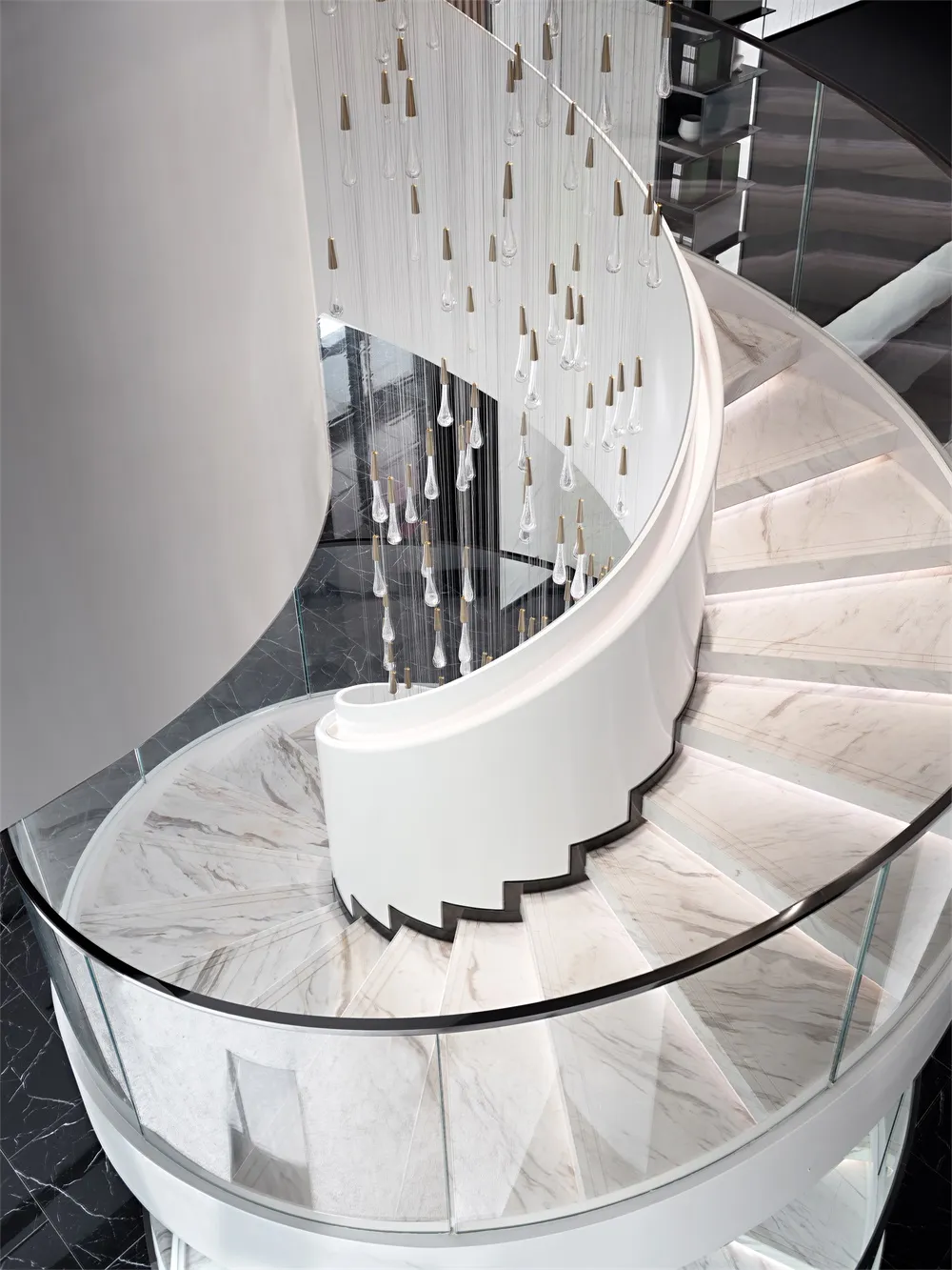Coiled staircase with marble steps, glass railings, and metallic elements.