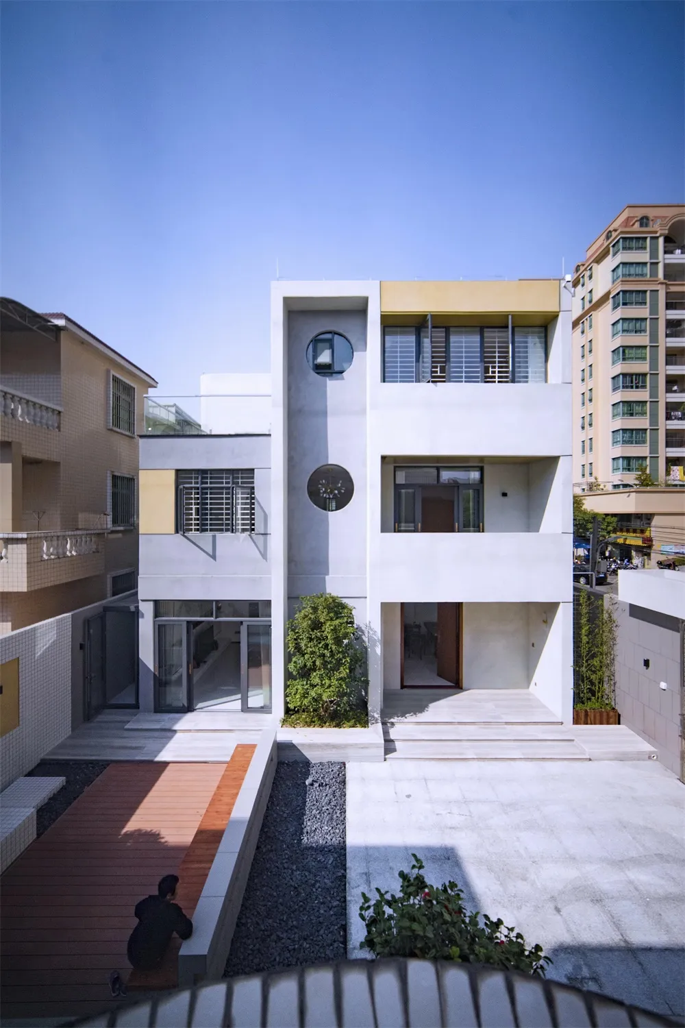 Modern residential architecture featuring concrete and glass materials.