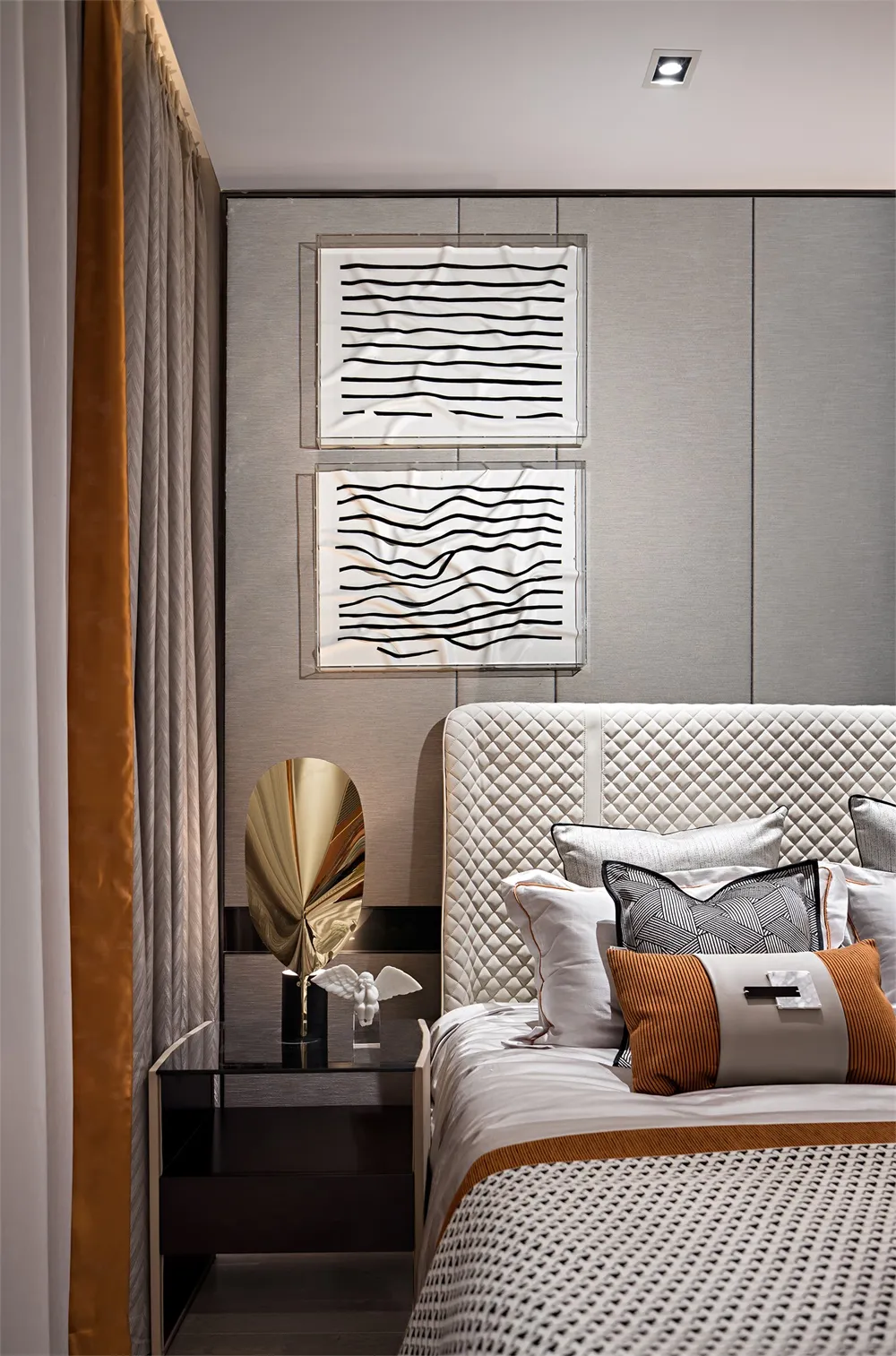 Modern bedroom featuring a wooden headboard adorned with fabric cushions.