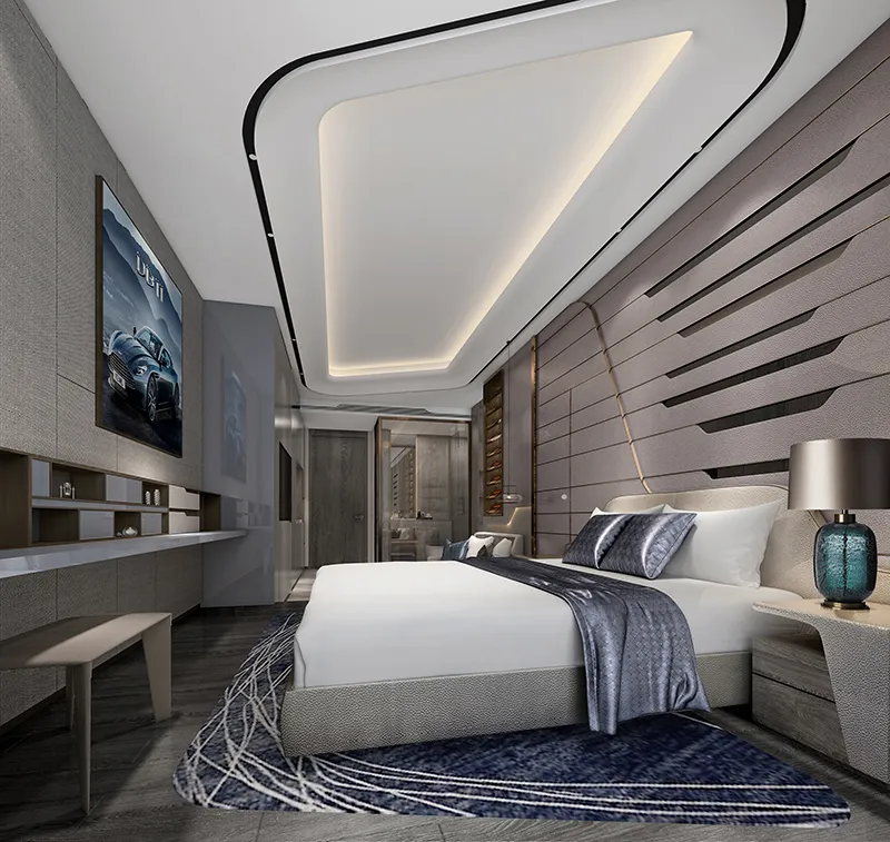 A modern minimalist bedroom featuring white walls, a grey bed, and a blue and white rug.