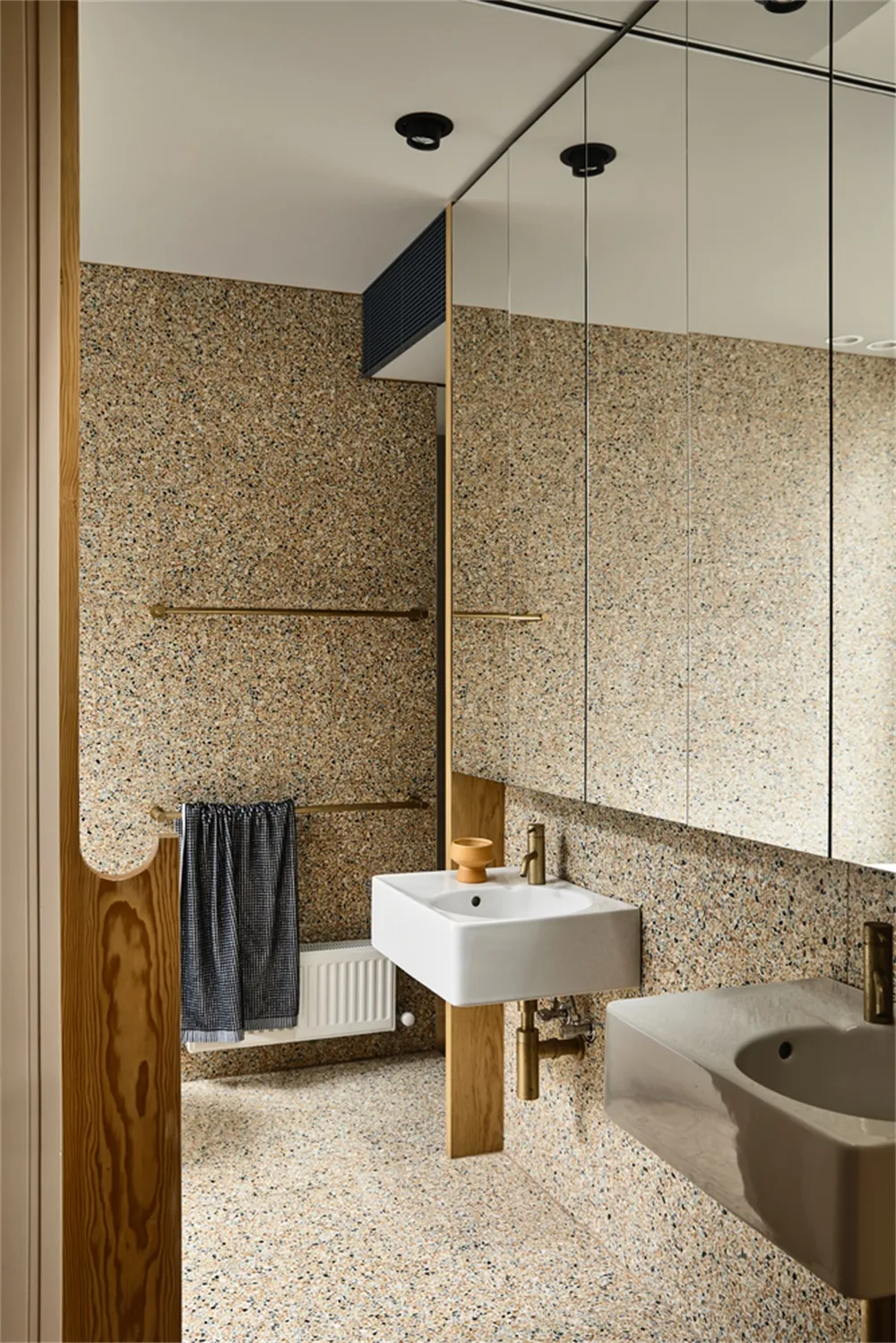 Modern bathroom featuring a terrazzo and wood design