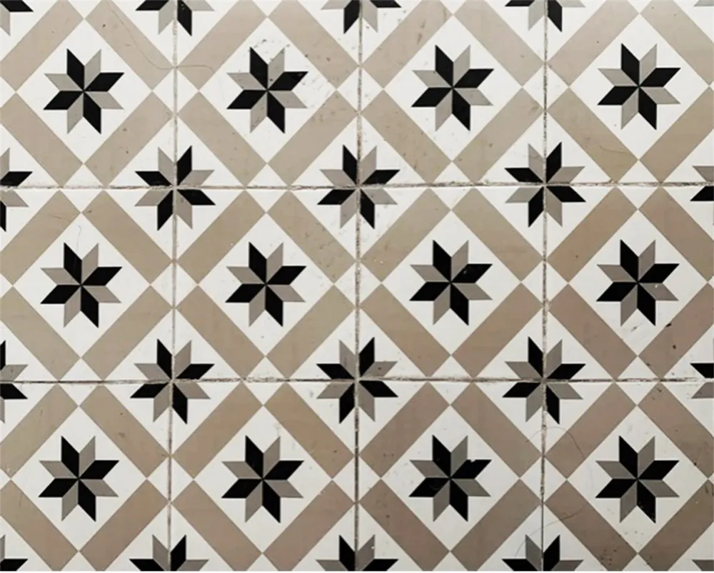 A modern interior design featuring a tile floor pattern with geometric shapes.