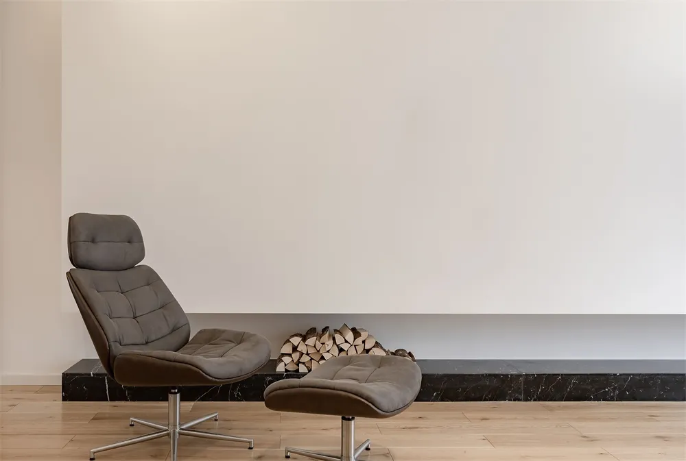 A modern interior design featuring a marble counter and wooden floor.
