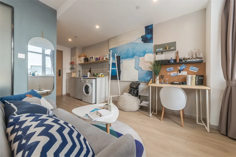 A minimalistic studio apartment with modern furniture and design features.