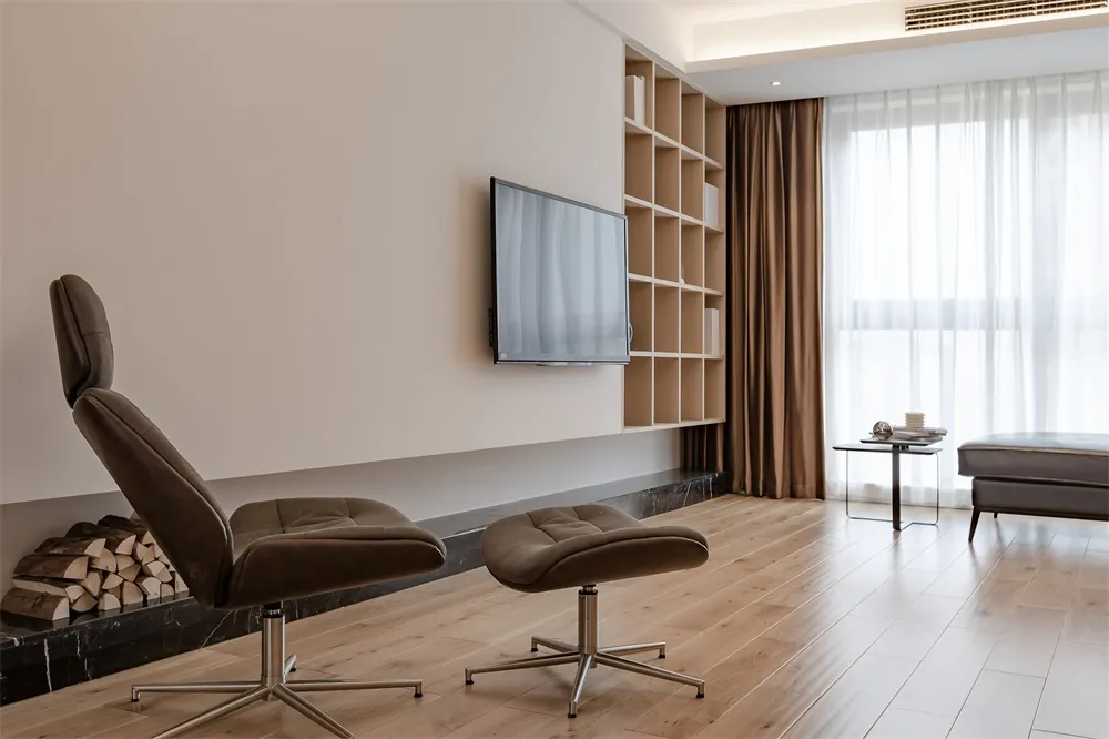 Modern living room featuring a leather recliner, walnut floor, and wooden shelving unit