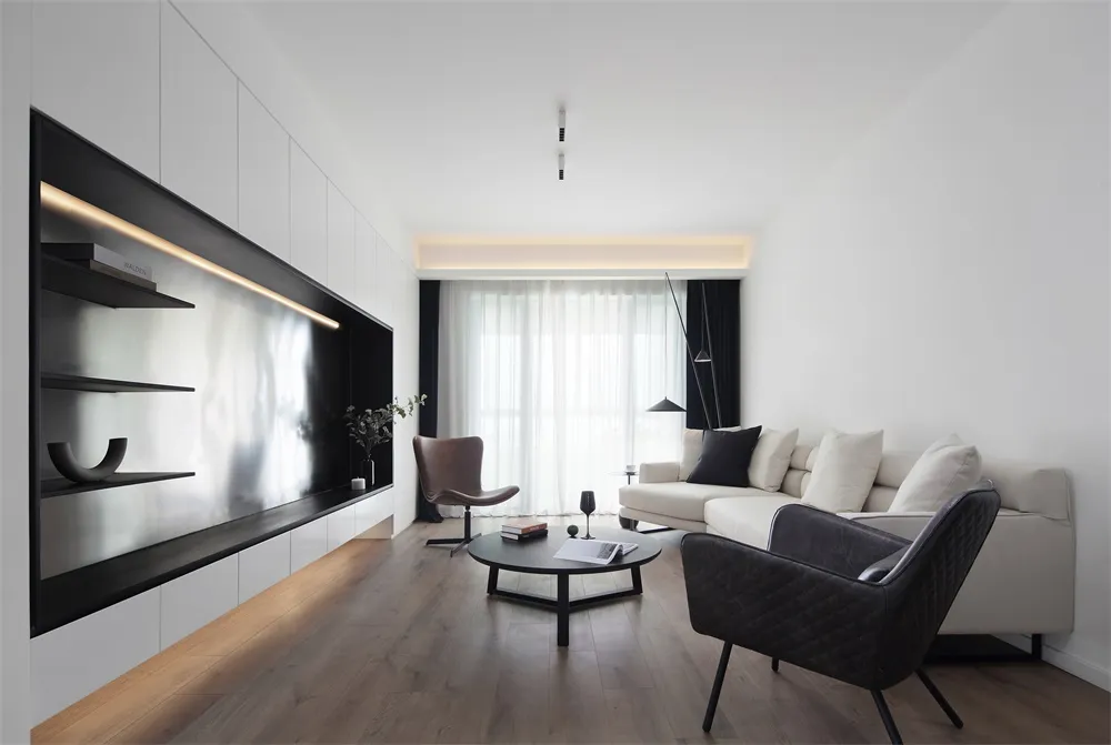 Modern living room featuring a white wall, industrial chairs, and a wooden floor