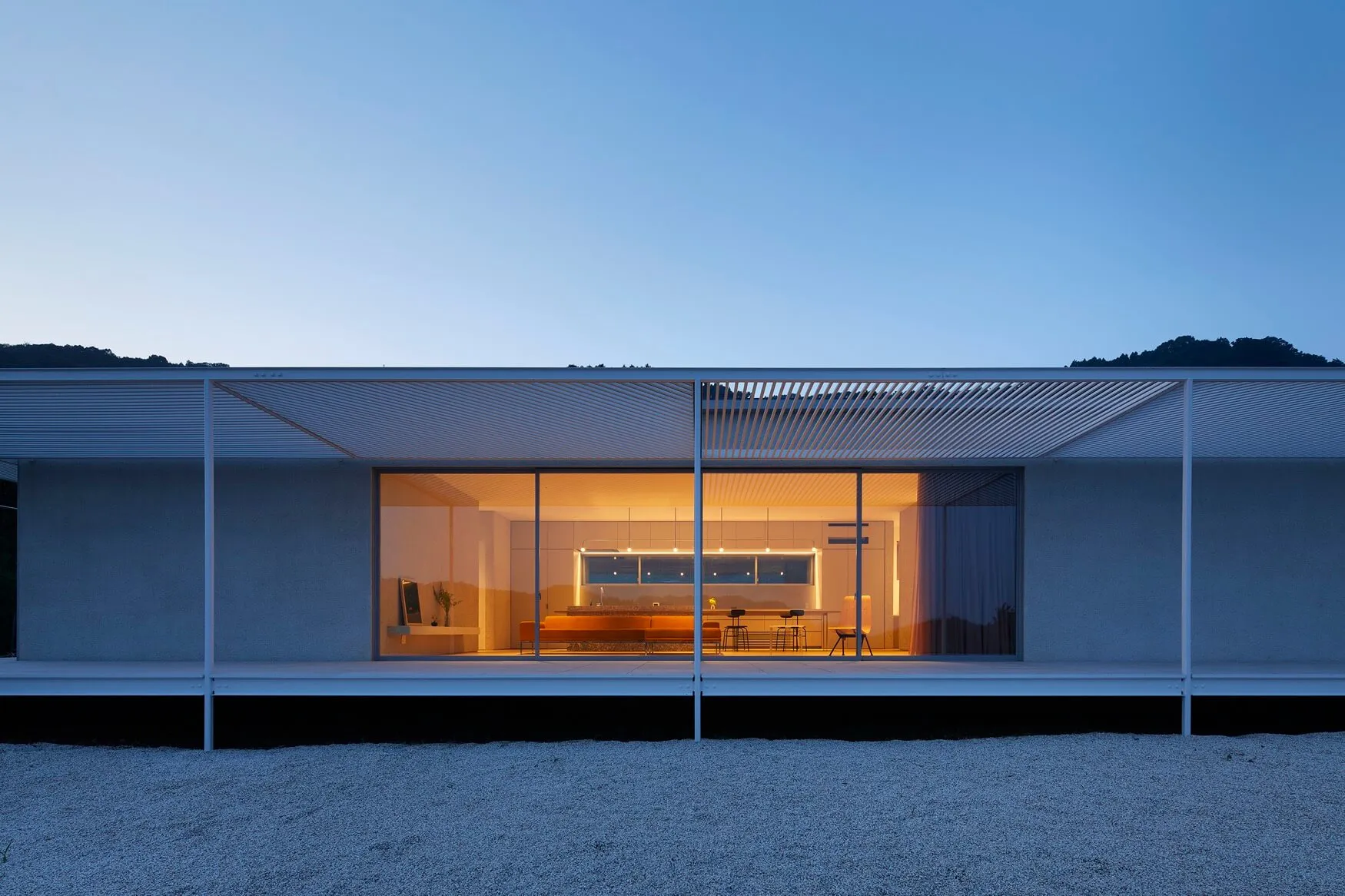 A modern residential interior featuring glass and wood materials.