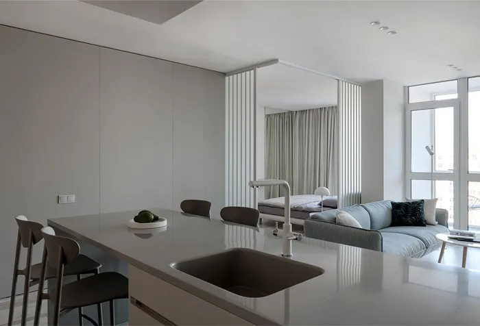 A modern residential kitchen featuring concrete material and minimalist design.