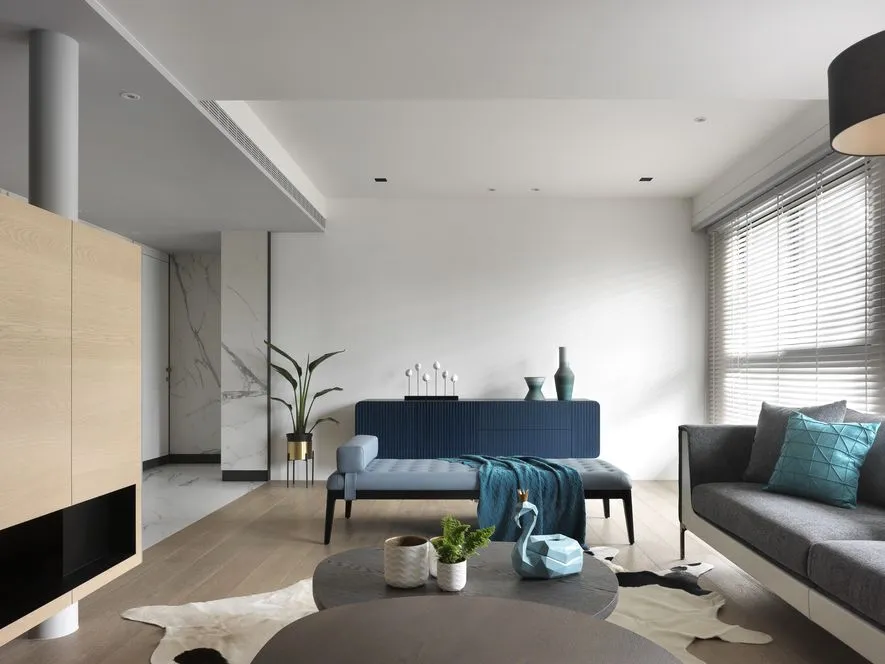 Modern living room with wood, leather, marble, and metal finishes