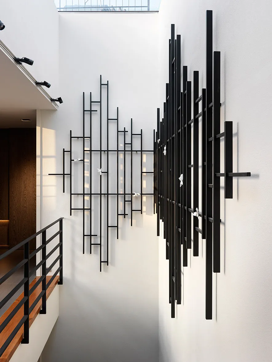 A modern interior with black metal decor and white walls.