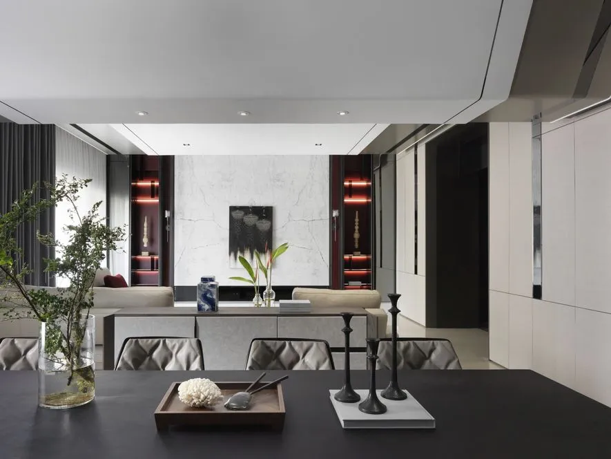 Modern living room featuring concrete and marble materials with contemporary design elements.