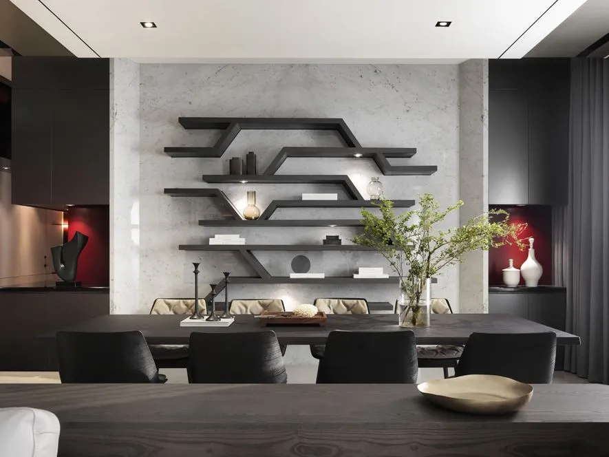 Modern living room with marble countertops, concrete walls, and black furniture