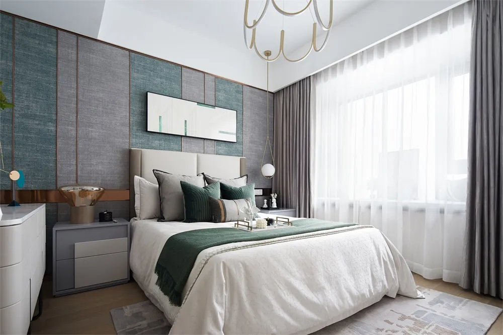 Modern bedroom featuring a green upholstered headboard.