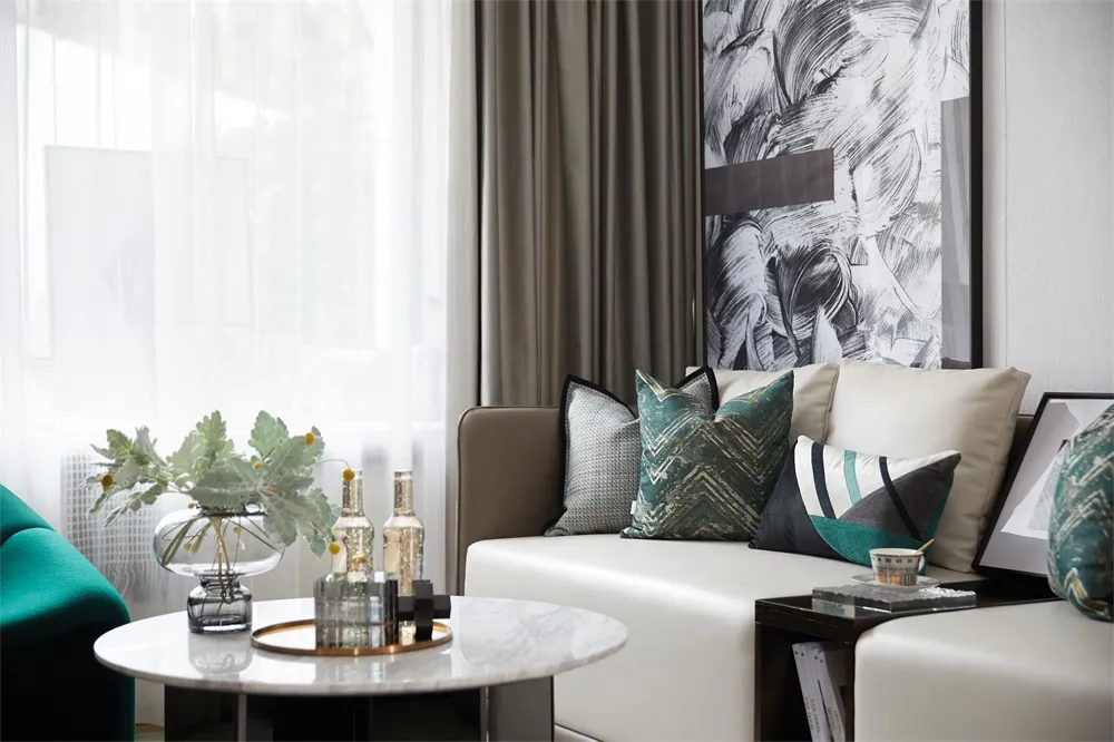 Modern living room with contemporary furniture and decorative elements.