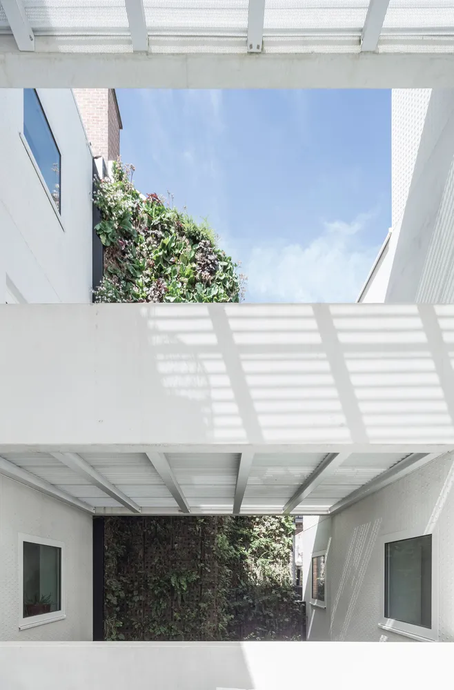 A modern interior with concrete and glass elements.