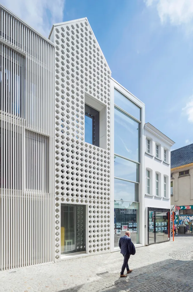 Modern building with white metal facade and large windows