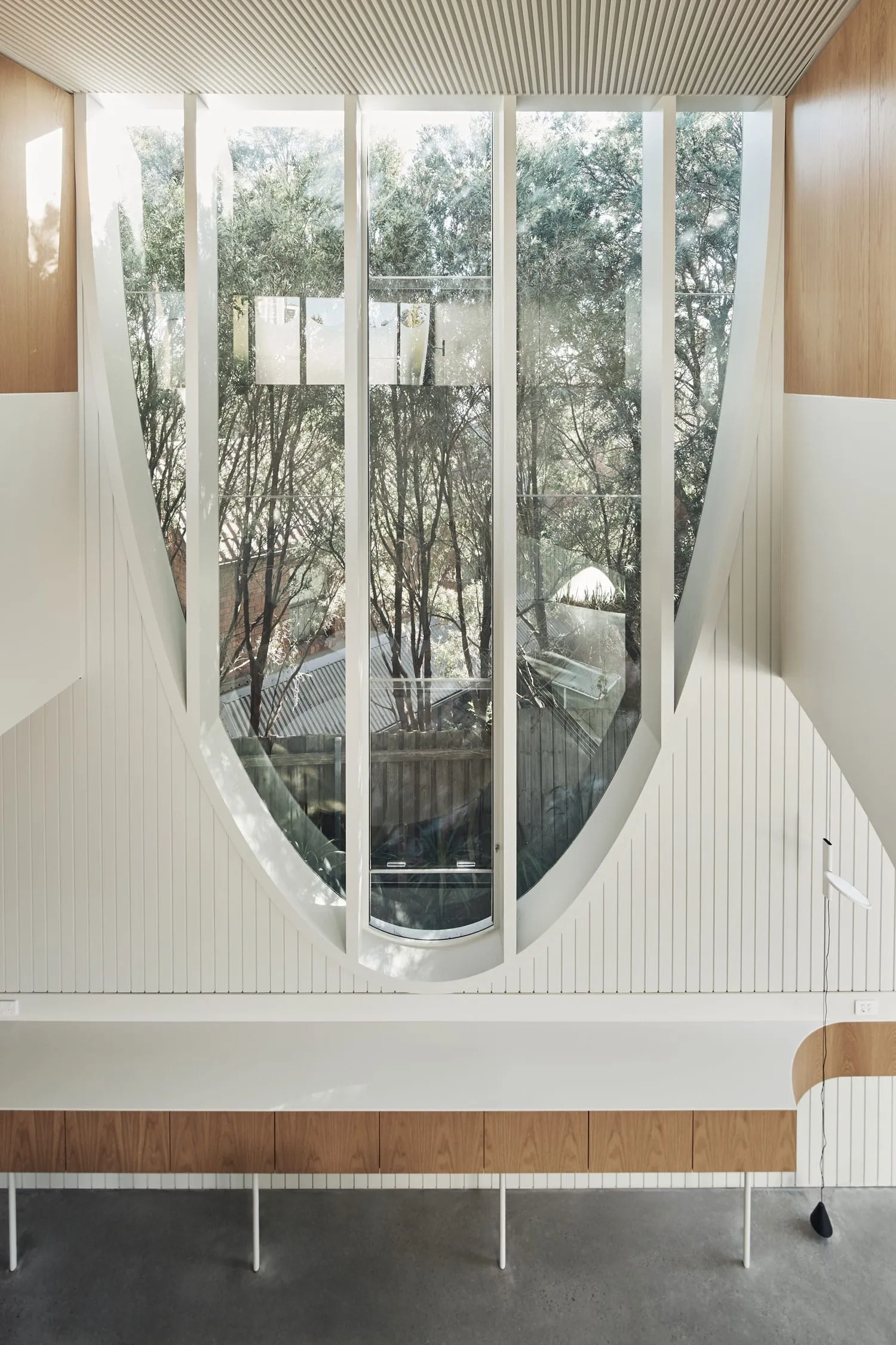 Modern interior design featuring large glass windows